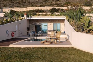 A modern outdoor pool area with lounge chairs and a lifebuoy. - Villa Vista I Free Heated Pool Dazzling Seaview (Kissamos)