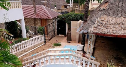 We are located in Galu Beach opposite lantana Hotel.