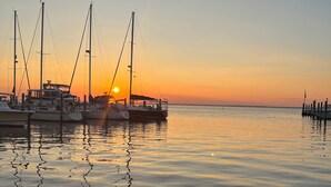A marina with several sailboats docked at sunset. - Beach Haven Long Beach Island (Beach Haven)