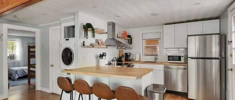 Coffee/tea maker, fridge, microwave, oven