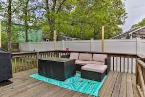 A wooden deck with outdoor furniture, including a sofa and a table, and a covered grill area. - Perfect House In Yarmouth, Book Now & Come Relax! (Yarmouth)