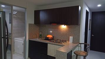 Fridge, stovetop, coffee/tea maker, cookware/dishes/utensils