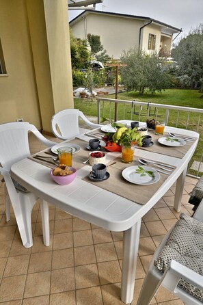 Enjoy a leisurely breakfast on the outdoor terrace with a view of the surrounding landscape.
