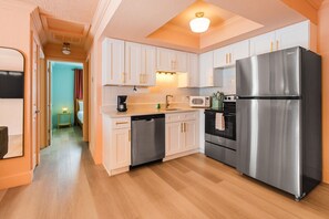 Fridge, coffee/tea maker, cookware/dishes/utensils, paper towels