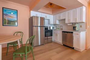 Enjoy cooking in this well-equipped kitchen with a refrigerator, microwave, oven, and dishwasher.