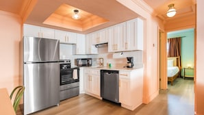 A compact kitchen with a refrigerator, stove, microwave, and dishwasher. - 137 · ☀Pool✔ Kitchen✔ Beach✔ Self Checkin✔ Free Parking✔ (Clearwater)
