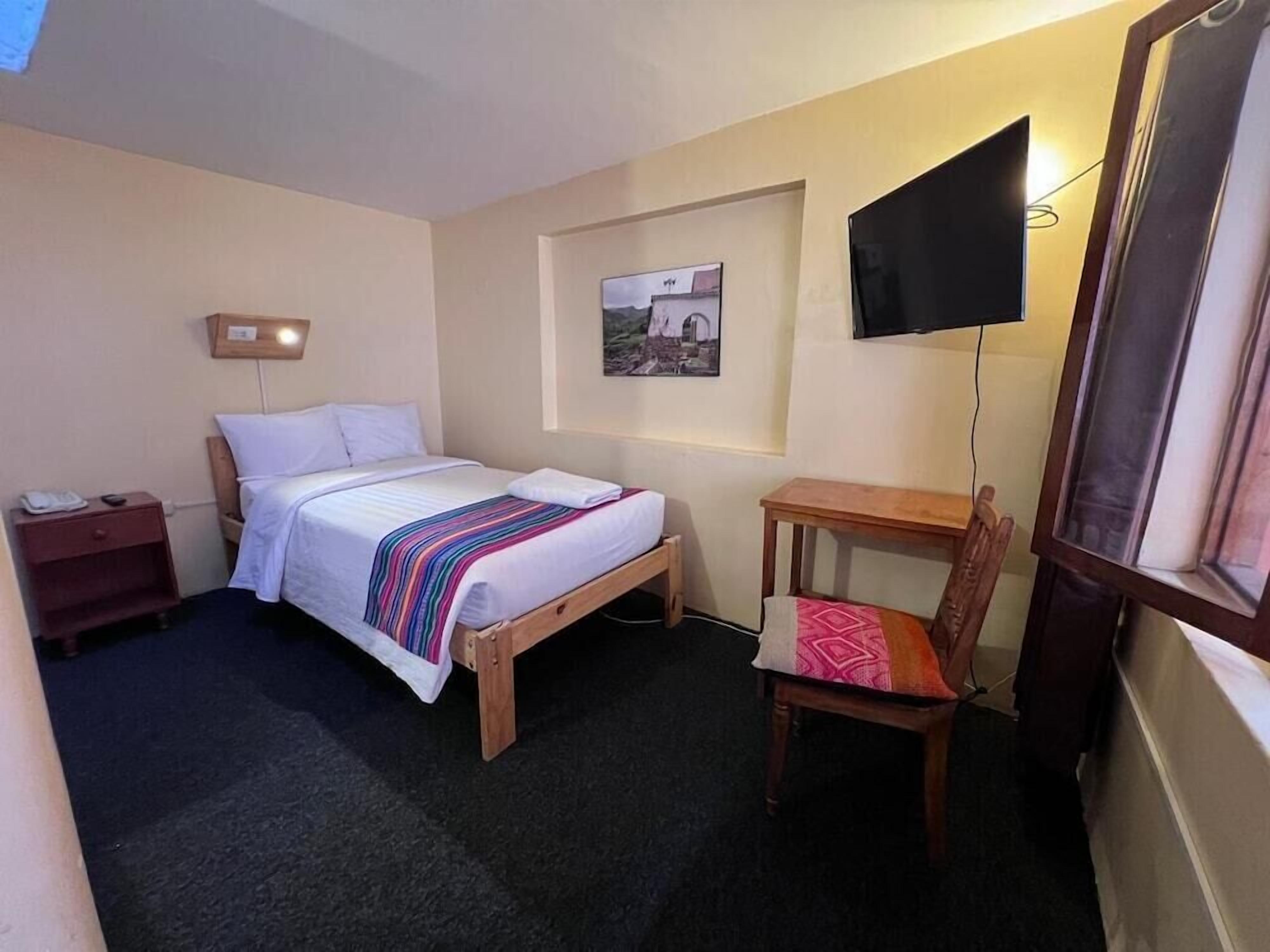 Premium bedding, down comforters, pillowtop beds, laptop workspace