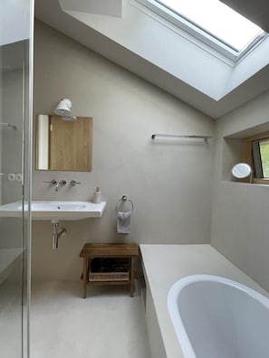Bathtub, hair dryer, towels