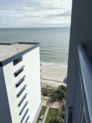 A high-rise building with a view of the beach and ocean. - Oceanfront Luxury 4BR Condo w/ Large Balcony & Pool (Myrtle Beach)