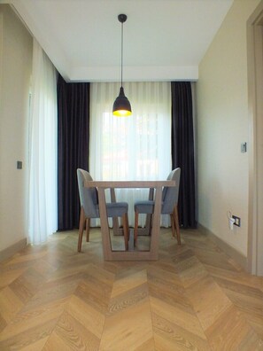 Deluxe Apartment | Living area | TV