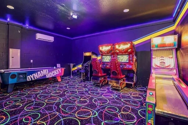 Experience endless fun in this vibrant game room with arcade classics, air hockey, and skee-ball, perfect for all ages.