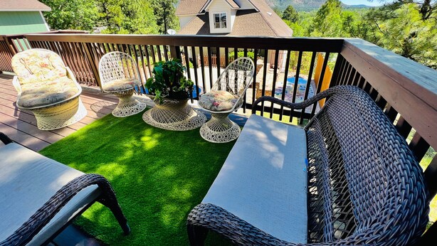 A deck with outdoor furniture, a small lawn, and a mountain view. - Hillside Home: Amazing Views w/ Big Deck 5 Min. From Downtown + Trailheads! (Flagstaff)