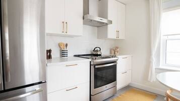 Fridge, coffee/tea maker, cookware/dishes/utensils
