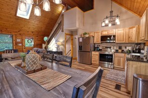 Enjoy casual dining and socializing in this kitchen with a large island and seating area.