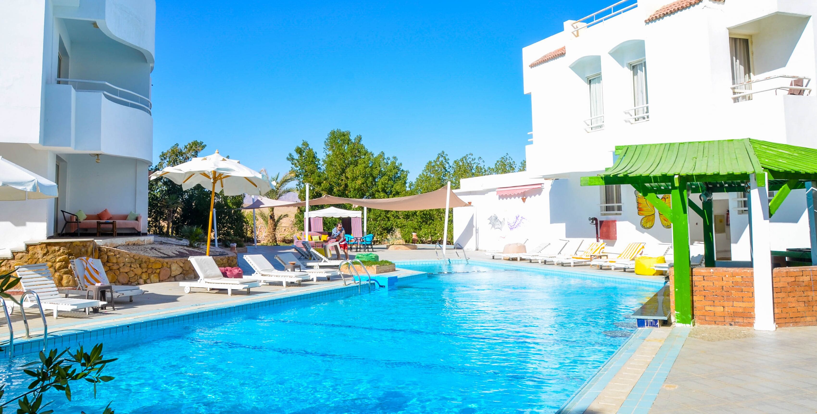 2 outdoor pools, pool umbrellas, lifeguards on site