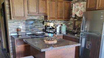 Family Cabin | Private kitchen | Fridge, kitchen islands