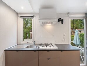 Microwave, freezer, dining tables