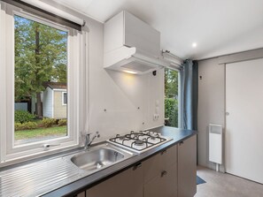 Microwave, freezer, dining tables