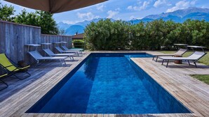A rectangular pool with wooden decking and lounge chairs. - Wonderful private villa with A/C, hot tub, WIFI, private pool, TV, patio and pets allowed (Colico)