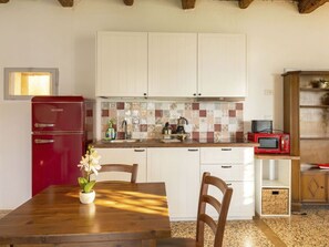 Microwave, toaster, highchair, dining tables