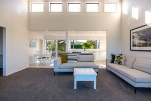 Executive Villa | Living area | Flat-screen TV - Driftwood Beach House with Spa Pool (Waiheke Island)