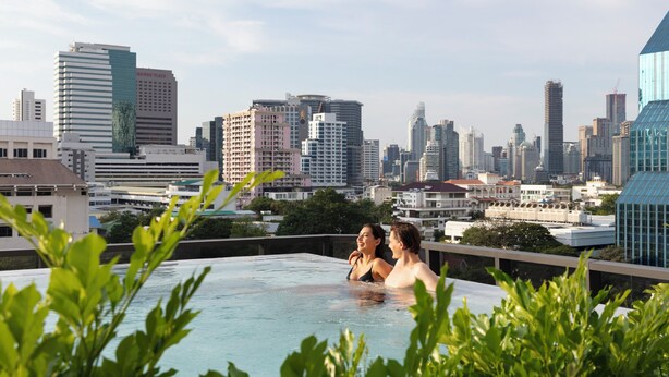 A rooftop pool with a city skyline in the background. - Ascott Embassy Sathorn Bangkok (Bangkok)