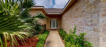 Inviting dog-friendly getaway with screened sunroom, pool, pickleball, & tennis