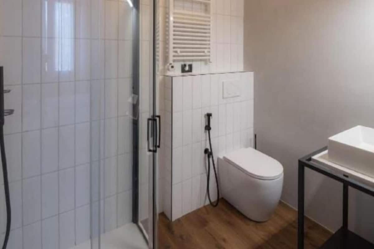 Bathroom | Shower, rainfall showerhead, hair dryer, towels