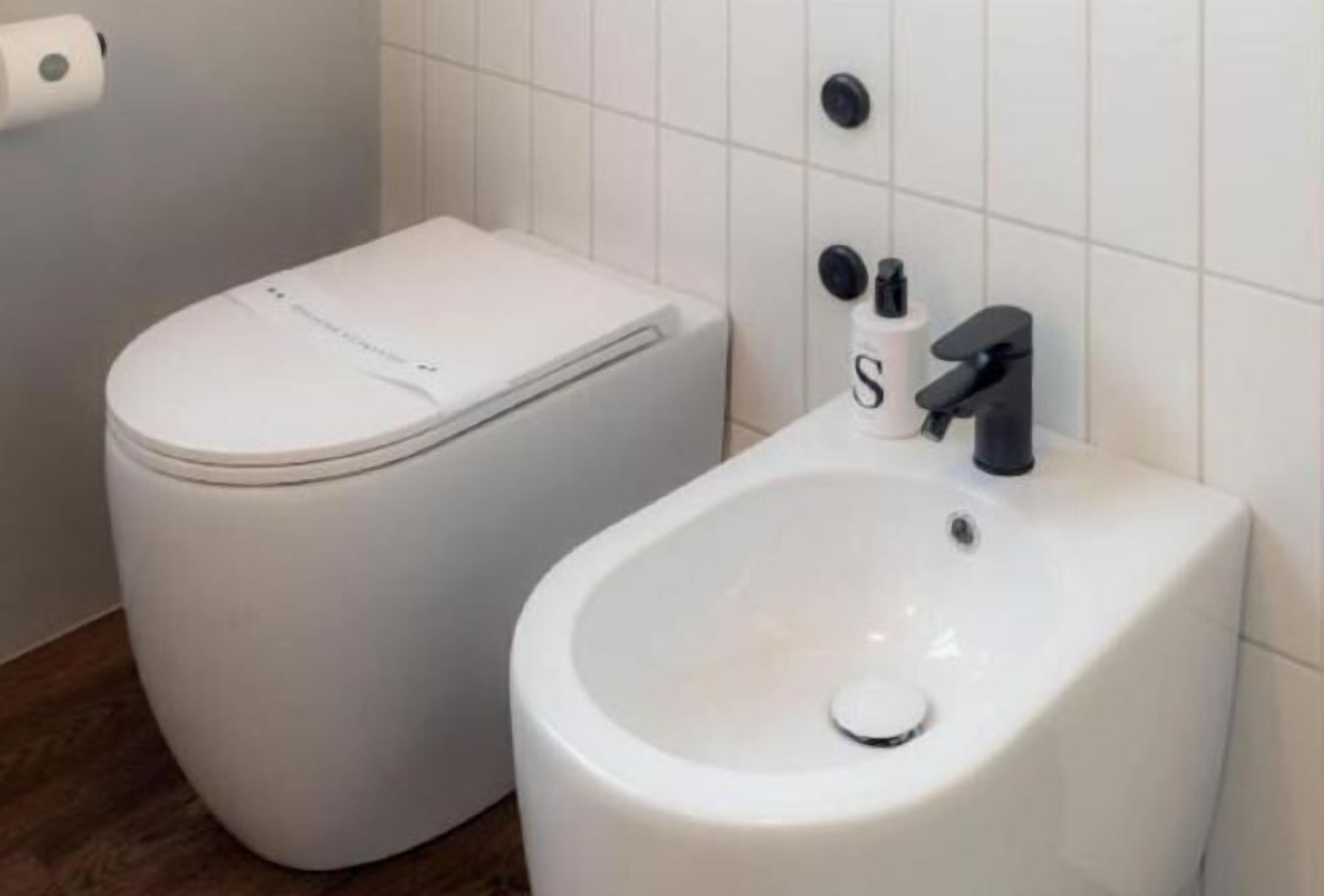 Bathroom | Shower, rainfall showerhead, hair dryer, towels