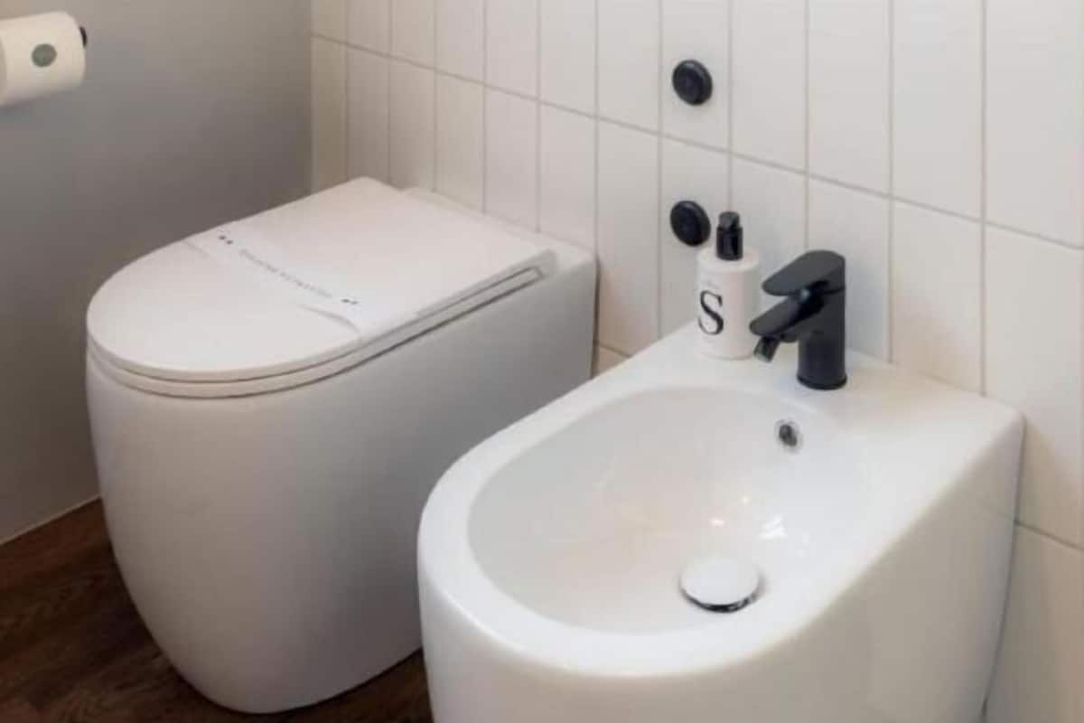 Bathroom | Shower, rainfall showerhead, hair dryer, towels