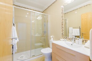 Bathtub, hair dryer, towels