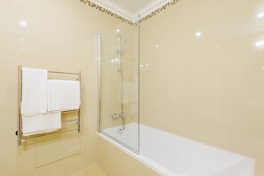 Bathtub, hair dryer, towels