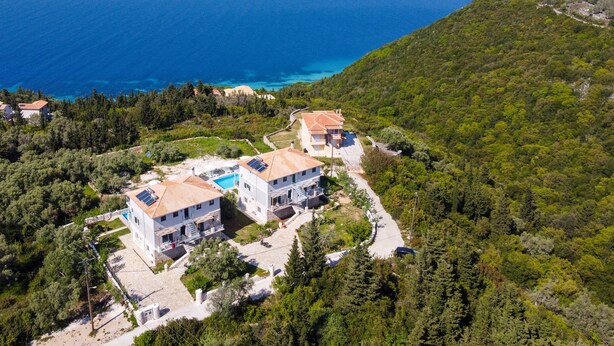 A coastal property with multiple buildings, a swimming pool, and a view of the sea. - Apartment "Superior Apartment A" close to the Beach with Shared Pool & Wi-Fi (?e???da)