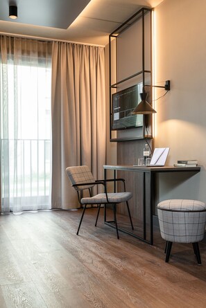 Hypo-allergenic bedding, desk, laptop workspace, blackout curtains