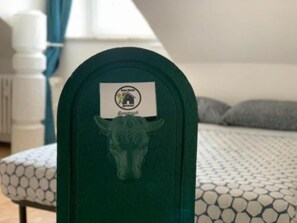 A green mailbox with a label that reads "Bergamo." - Sweet Statute 9 (Torino)