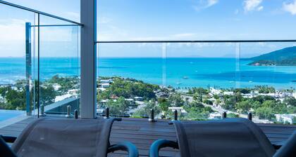 Relax in style as you overlook the Coral Sea and Whitsunday Islands beyond