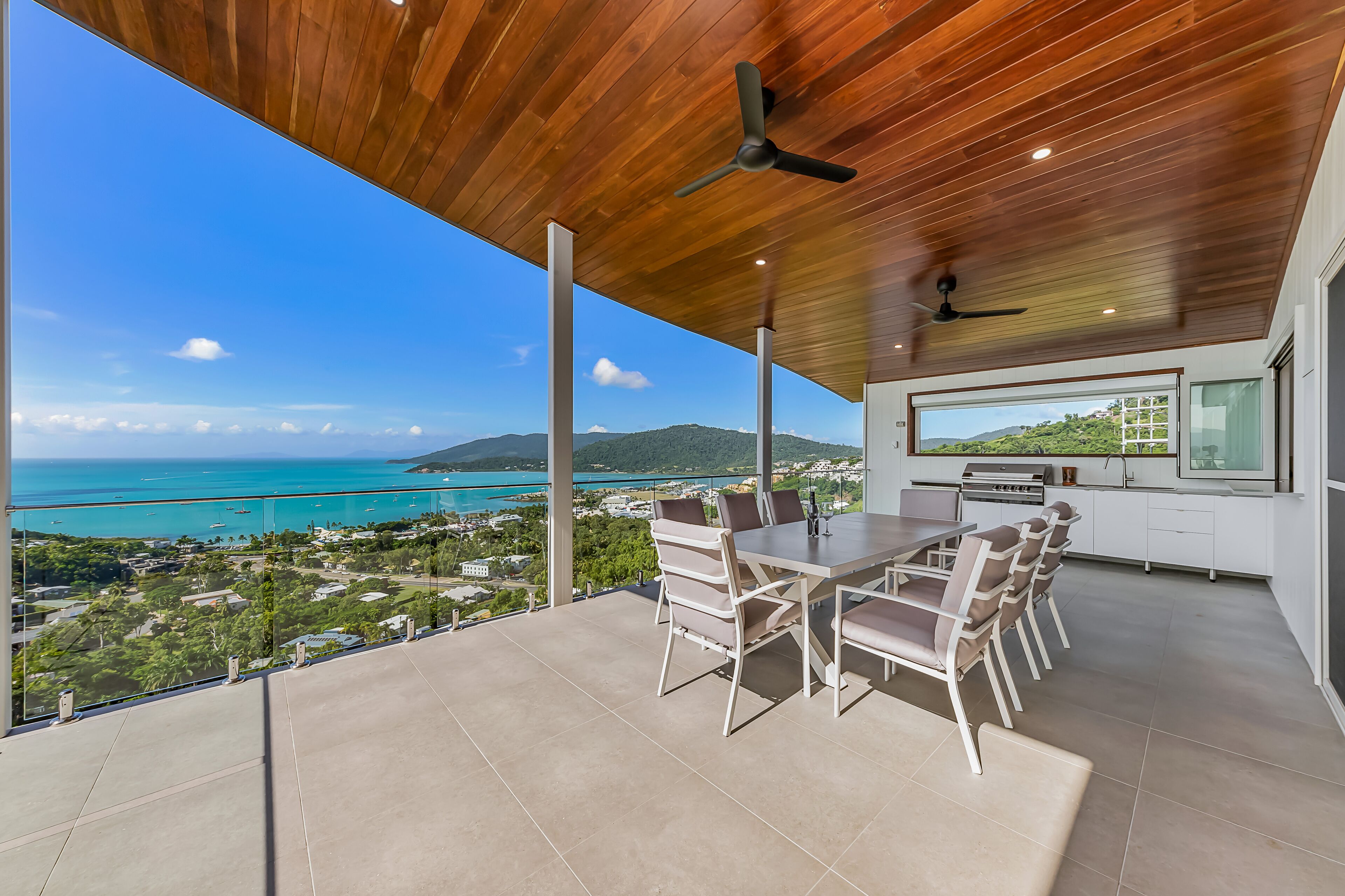 Relax in style as you overlook the Coral Sea and Whitsunday Islands beyond — image 5