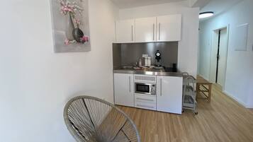 Design Apartment | Private kitchen | Espresso maker, coffee/tea maker, electric kettle, cleaning supplies