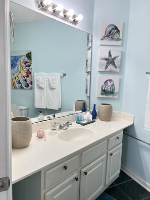 Combined shower/tub, hair dryer, towels, soap