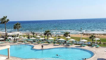 Outdoor pool, open 10:00 AM to 6:00 PM, pool umbrellas, pool loungers