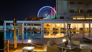 Outdoor pool, open 10:00 AM to 6:00 PM, pool umbrellas, pool loungers
