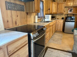 Fridge, microwave, stovetop, coffee/tea maker