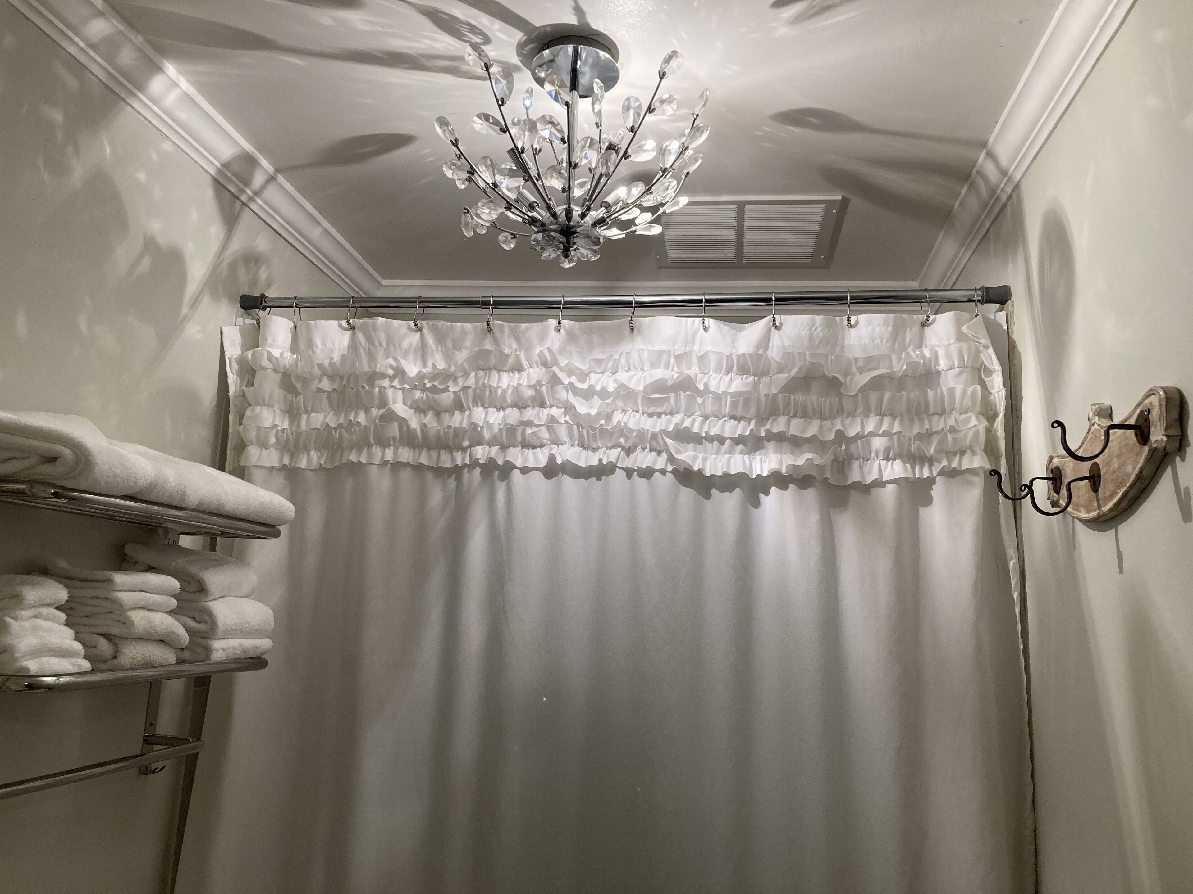 Combined shower/bathtub, towels, soap, toilet paper