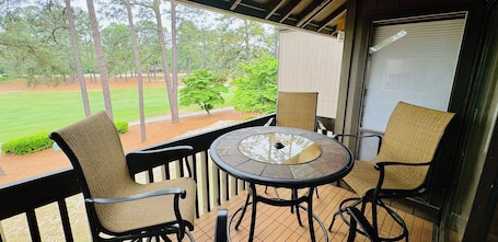 Outdoor dining. 2 Br Condo on resort Property access to members benefits pool/hottub/golf cart