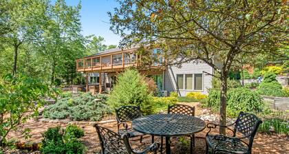 Green side smart home with golf, beach/lake access, off-site dock & EV charger