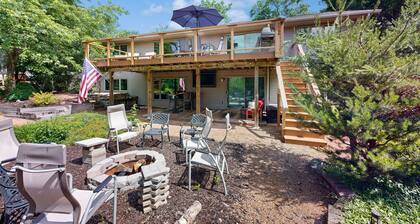 Green side smart home with golf, beach/lake access, off-site dock & EV charger