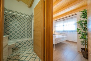 Bathtub, hair dryer, towels