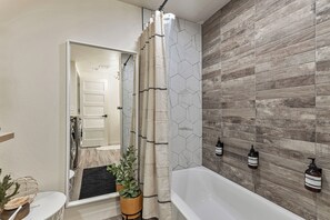 Combined shower/tub, hair dryer, towels, soap