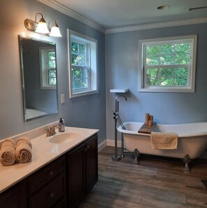 Bathtub, hair dryer, towels, soap
