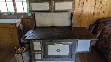 Fridge, coffee/tea maker, toaster, cookware/dishes/utensils